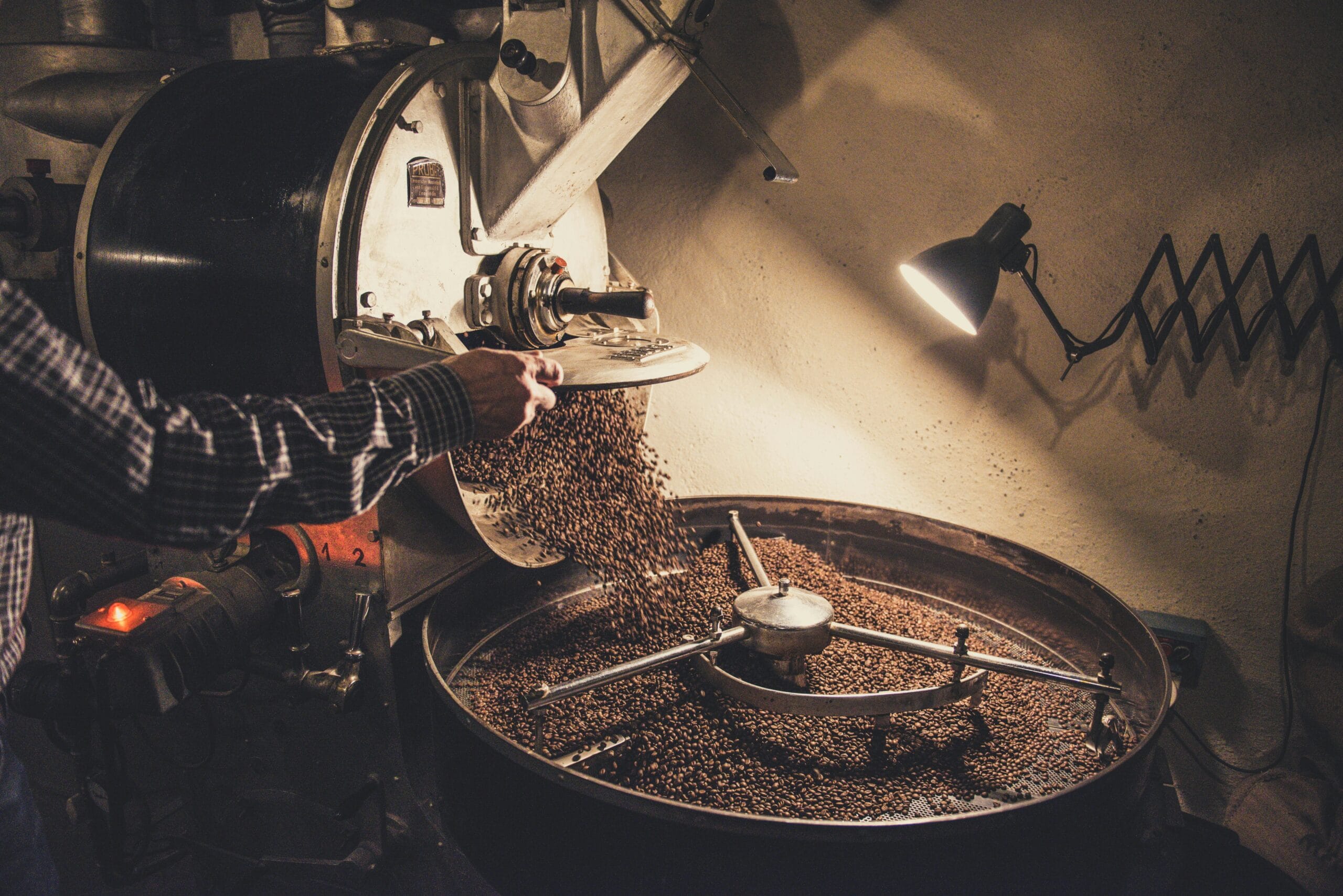 Business Coaching Process | PointView Coaching Business Coaching Process - a person pouring coffee beans into a machine