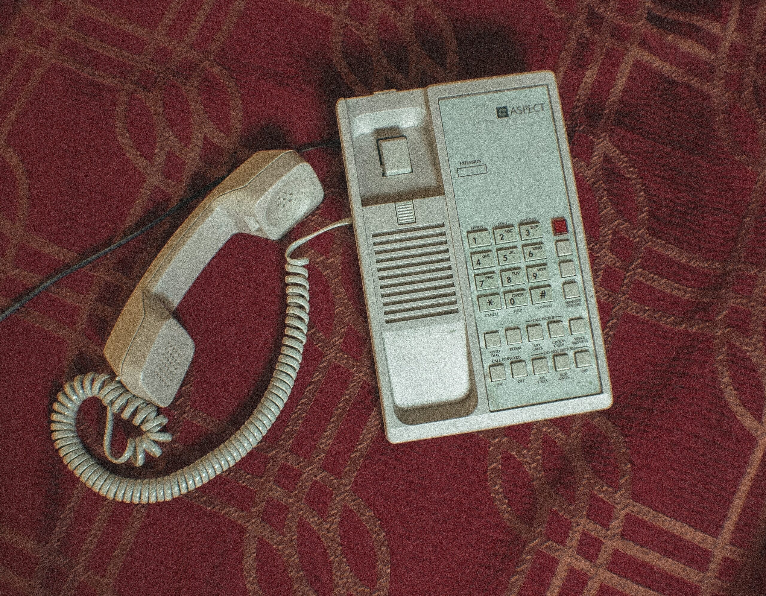 unanswered phone a telephone on a red surface