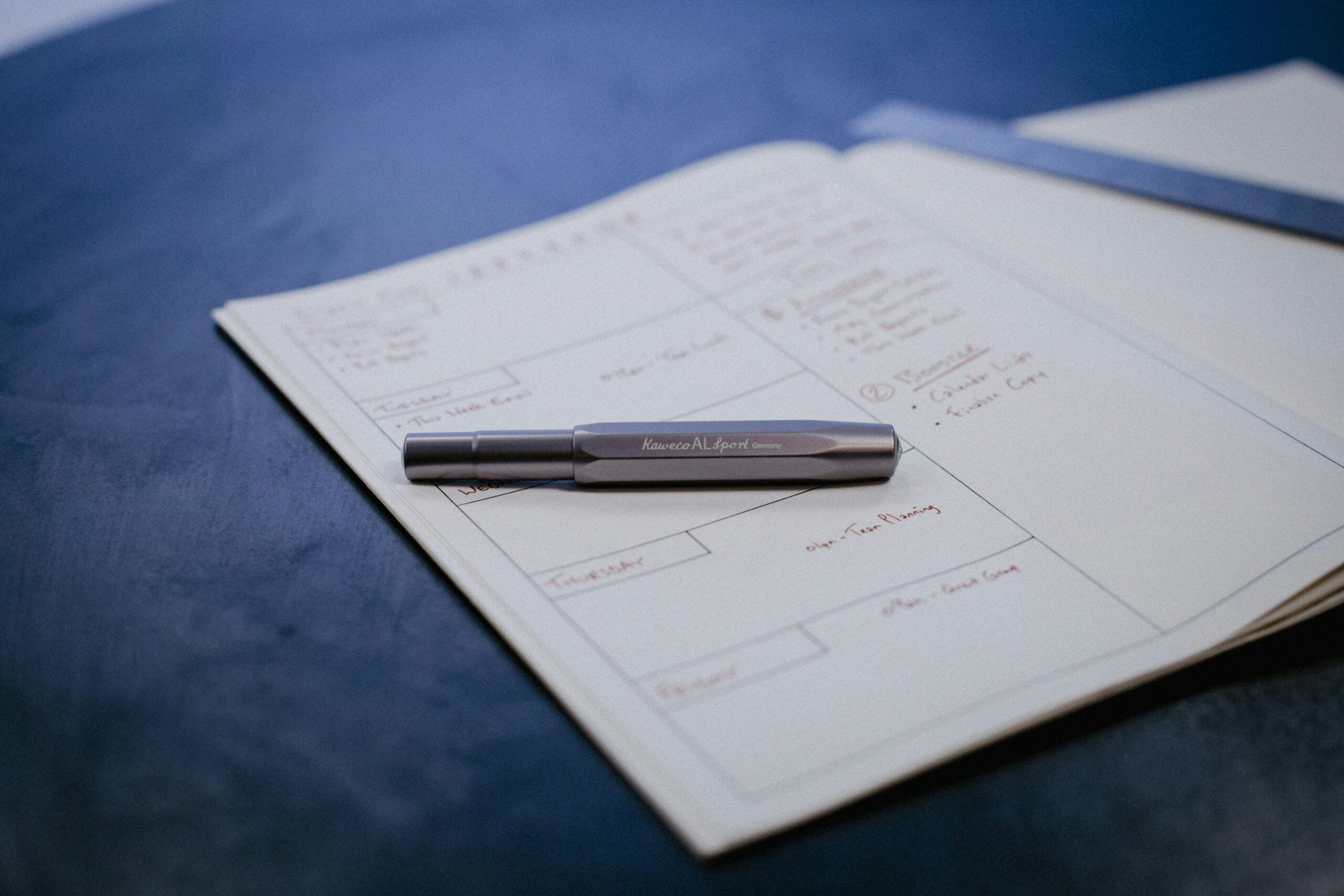 a pen on a piece of paper
